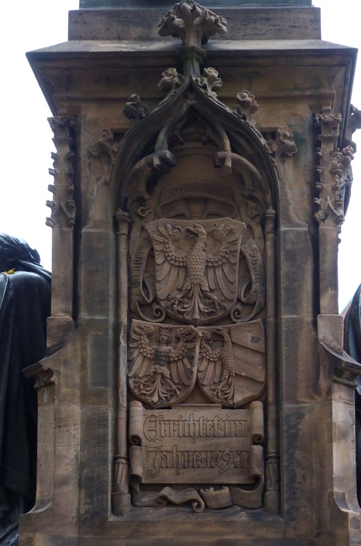 Martin Behaim the Sea Voyager Stone base, back with Nuremberg's coat of arms and inauguration inscription