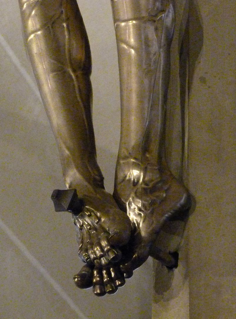 Crucifix Feet nailed to the cross, diagonal view