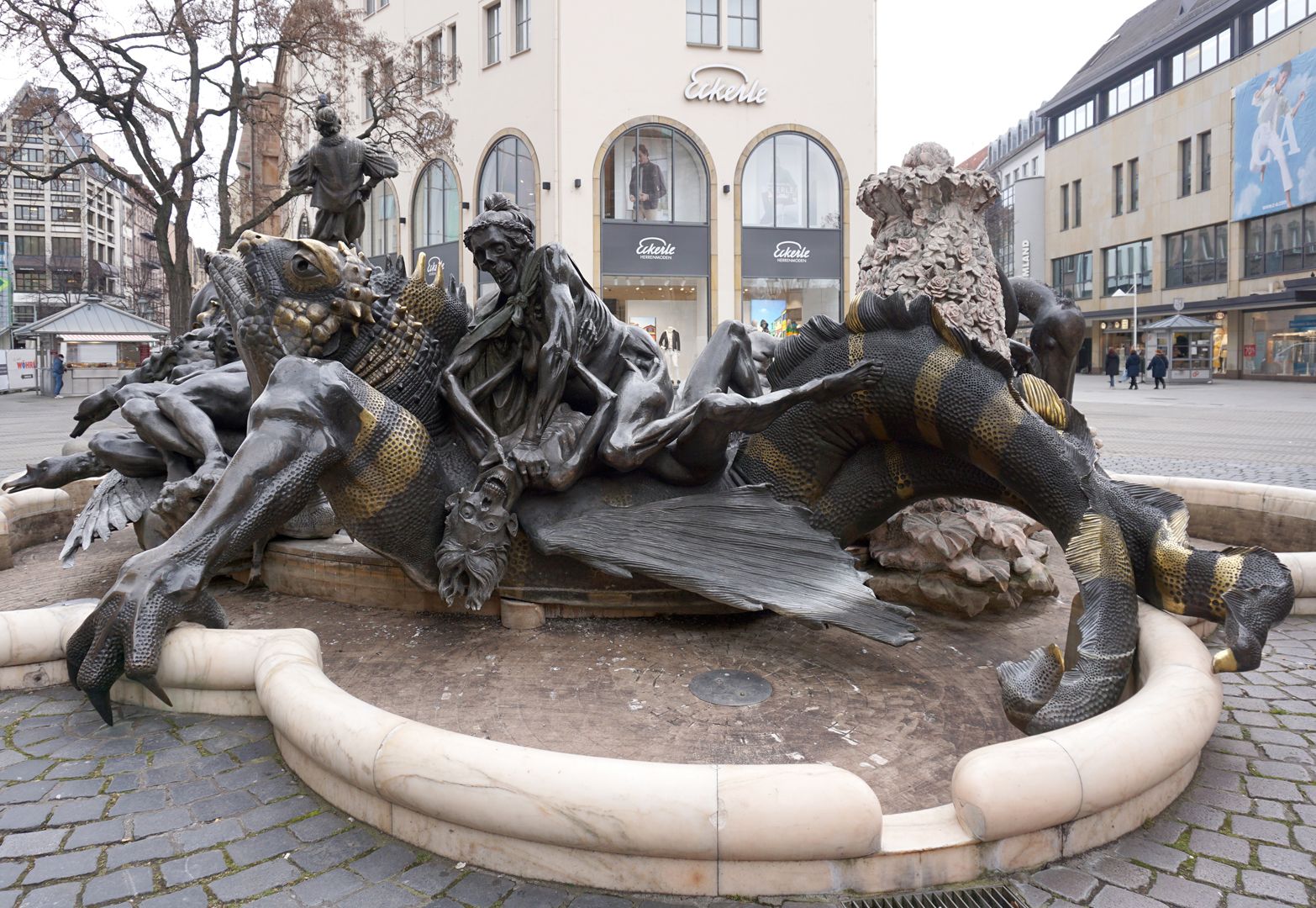 Marriage carousel/ Hans Sachs Fountain A "Hell Dragon" striped green and golden, is carrying an already dead, partially rotten and skeletonised couple, which is at each other's throats" (J.W.)