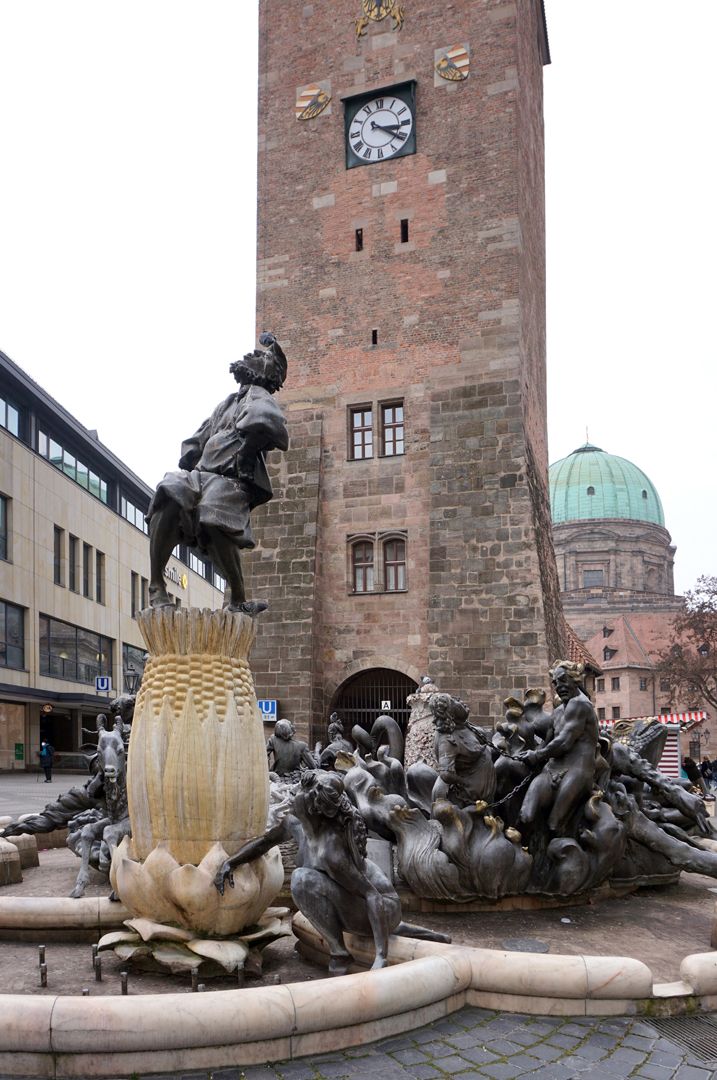 Marriage carousel/ Hans Sachs Fountain Hans Sachs dances over the chaos of his marriage on the marital rock