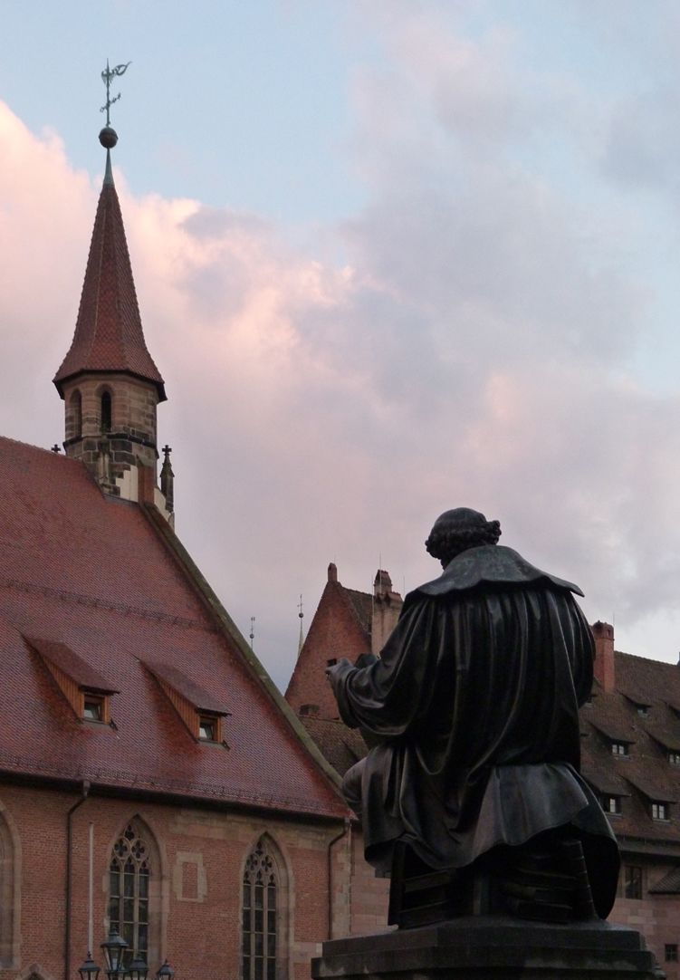 Hans- Sachs-Memorial Memorial with Hospital of the Holy Spirit in the background