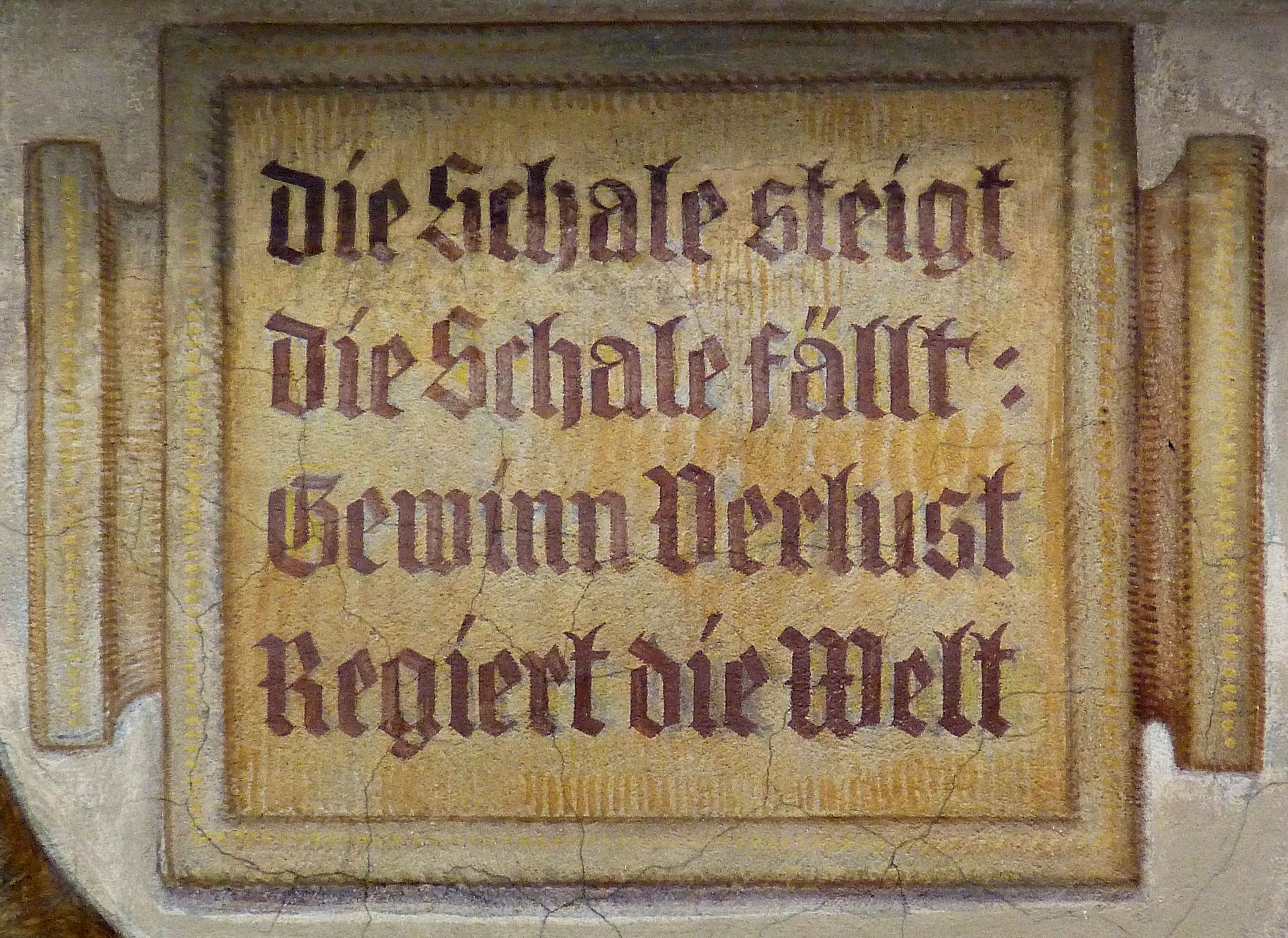 Merchants´trail South front, motto on a weighing scale