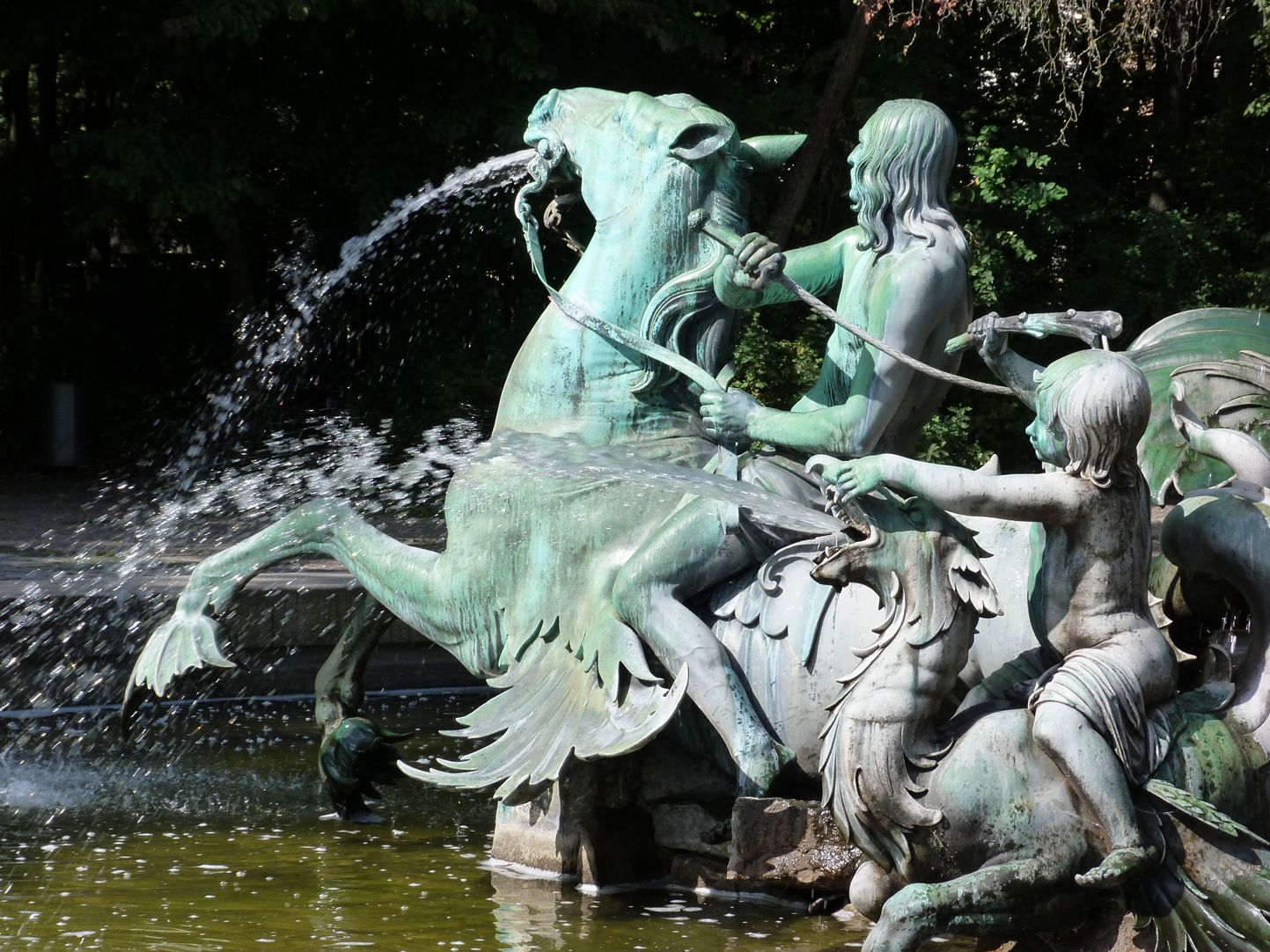 Neptun-Fountain Triton rider sitting on a seahorse, putti riding on a dragon, south side