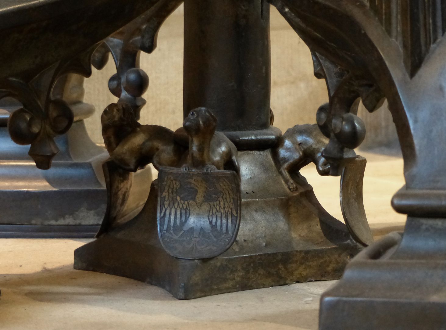 Baptismal font Central pillar basis with mythical creature as carrier of the imperial coat of arms