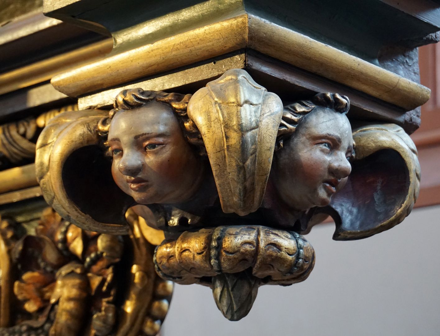 High Altar Hanging head capital below the right altarpiece