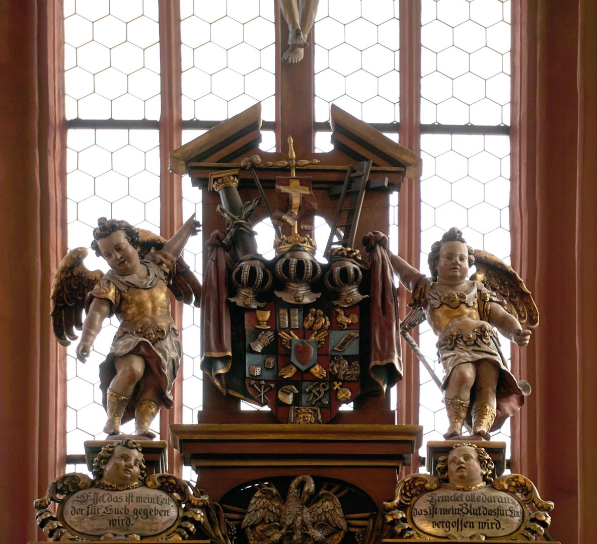 High Altar upper finial: crucifix, coat of arms with Passion insignia, below a pelican