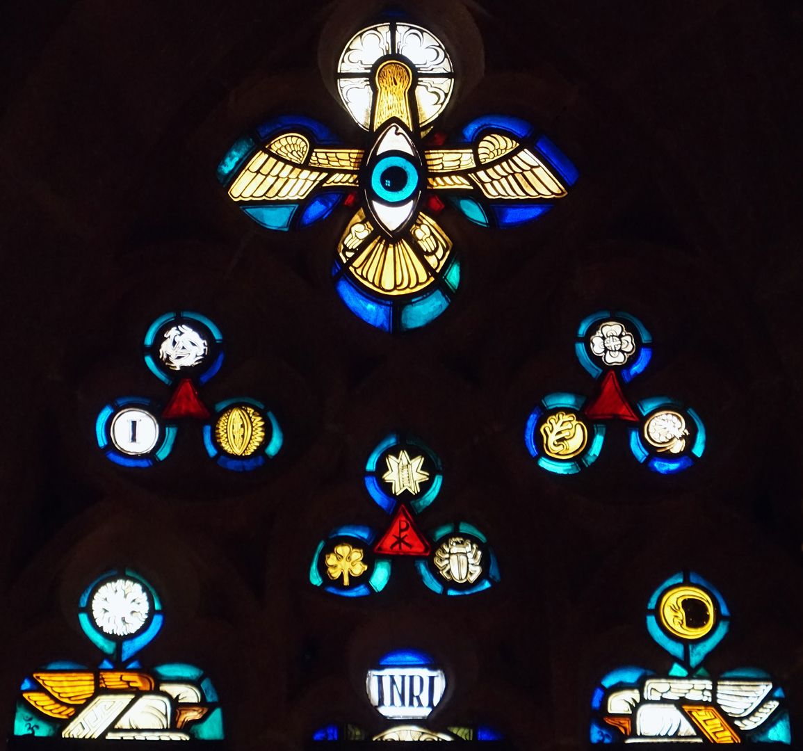 East window in the choir of St Nicholas and St Ulrich Window top with the Holy Spirit and the Eye of God