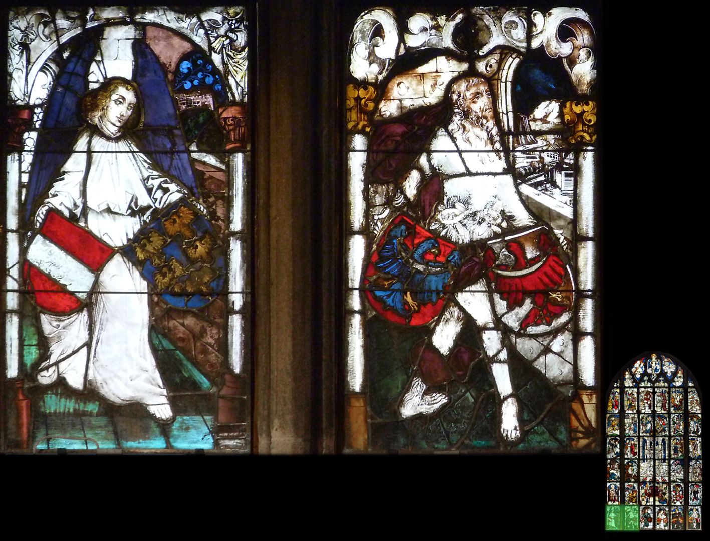 Imperial window Left: Angel with the arms red-white-red of New Austria and Lower Austria with five golden eagles; right: Wild Man with the coats ofarms of the Duchy of Carniola and the County of Tyrol.
